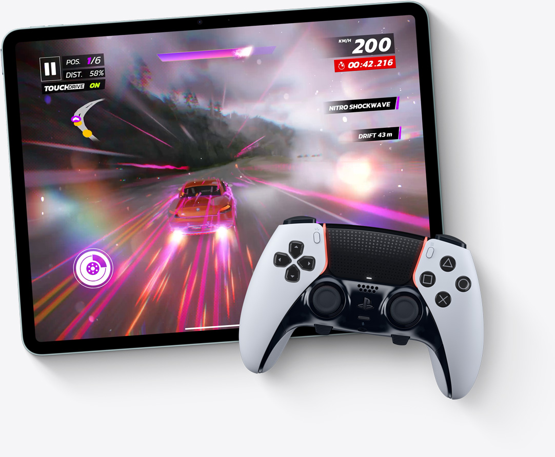 iPad Air, landscape orientation, screen displays video game Asphalt Legends Unite, Playstation controller