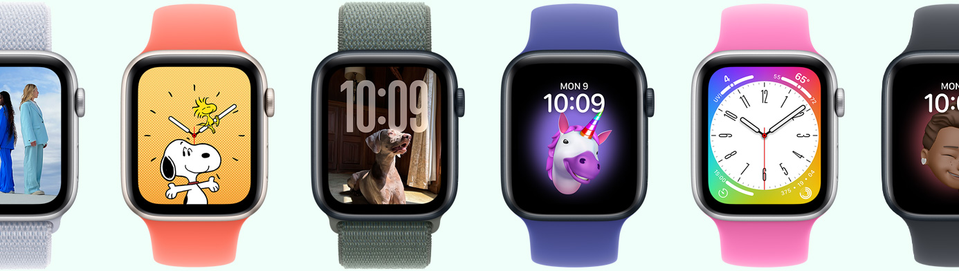 Multiple Apple Watch devices showing various watch face options