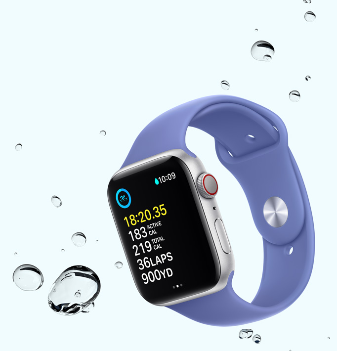 Apple Watch SE displaying a swim workout screen with water droplets near the device