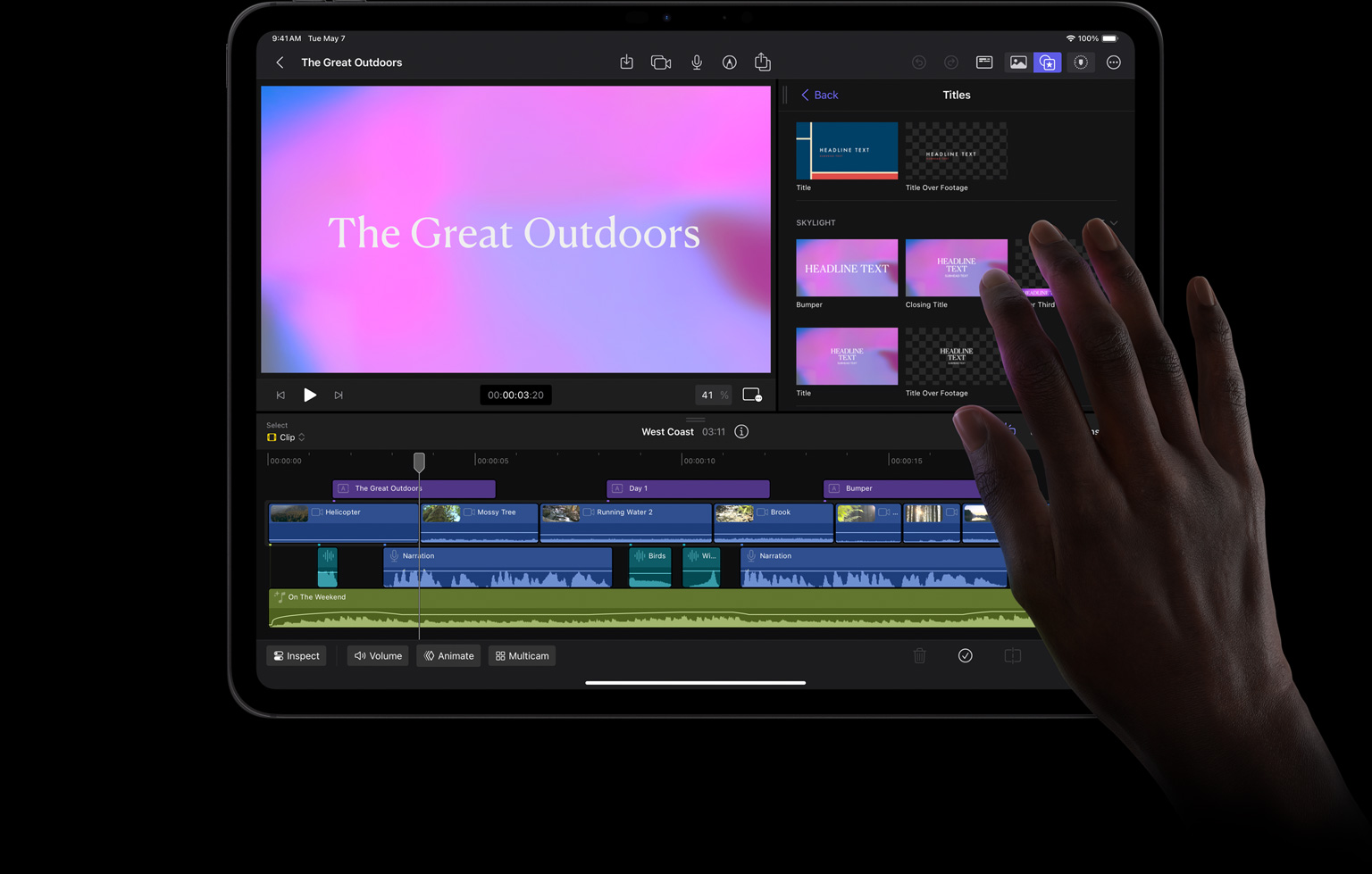 Hand with finger selecting pink and blue background for title treatment in Final Cut Pro for iPad on iPad Pro.